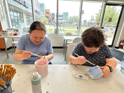 KWA members at Crock A Doodle painting pottery