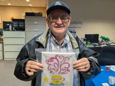 KWA Member Steve with his painting from Arts event at our office